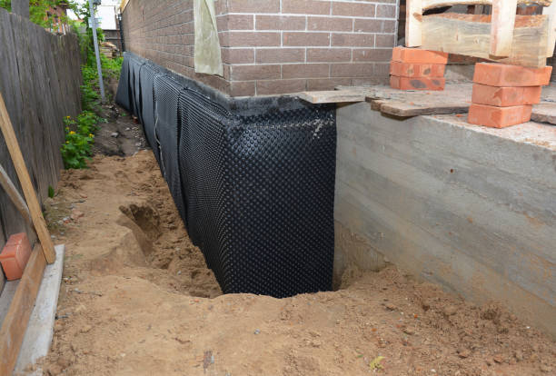 Happy homeowners after waterproofing job in Austin